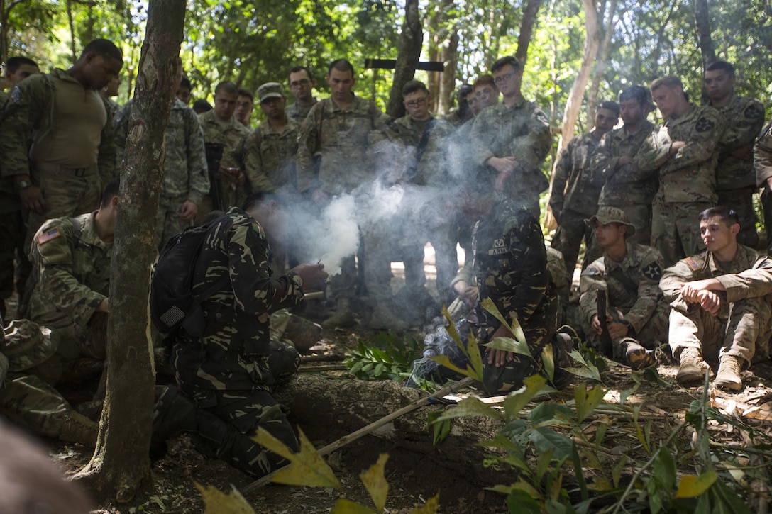 Philippine Special Forces demonstrate to U.S. Soldiers, 1st Battalion, 23rd Infantry Regiment, how to make a fire from bamboo shoots during a subject matter expert exchange in support of Balikatan 2017 at Fort Magsaysay in Santa Rosa, Nueva Ecija, May 13, 2017. U.S. Soldiers trained with Philippine Special Forces to understand the Armed Forces of the Philippines’ techniques for operating in a jungle environment. Balikatan is an annual U.S.-Philippine bilateral military exercise focused on a variety of missions, including humanitarian and disaster relief, counterterrorism, and other combined military operations. 