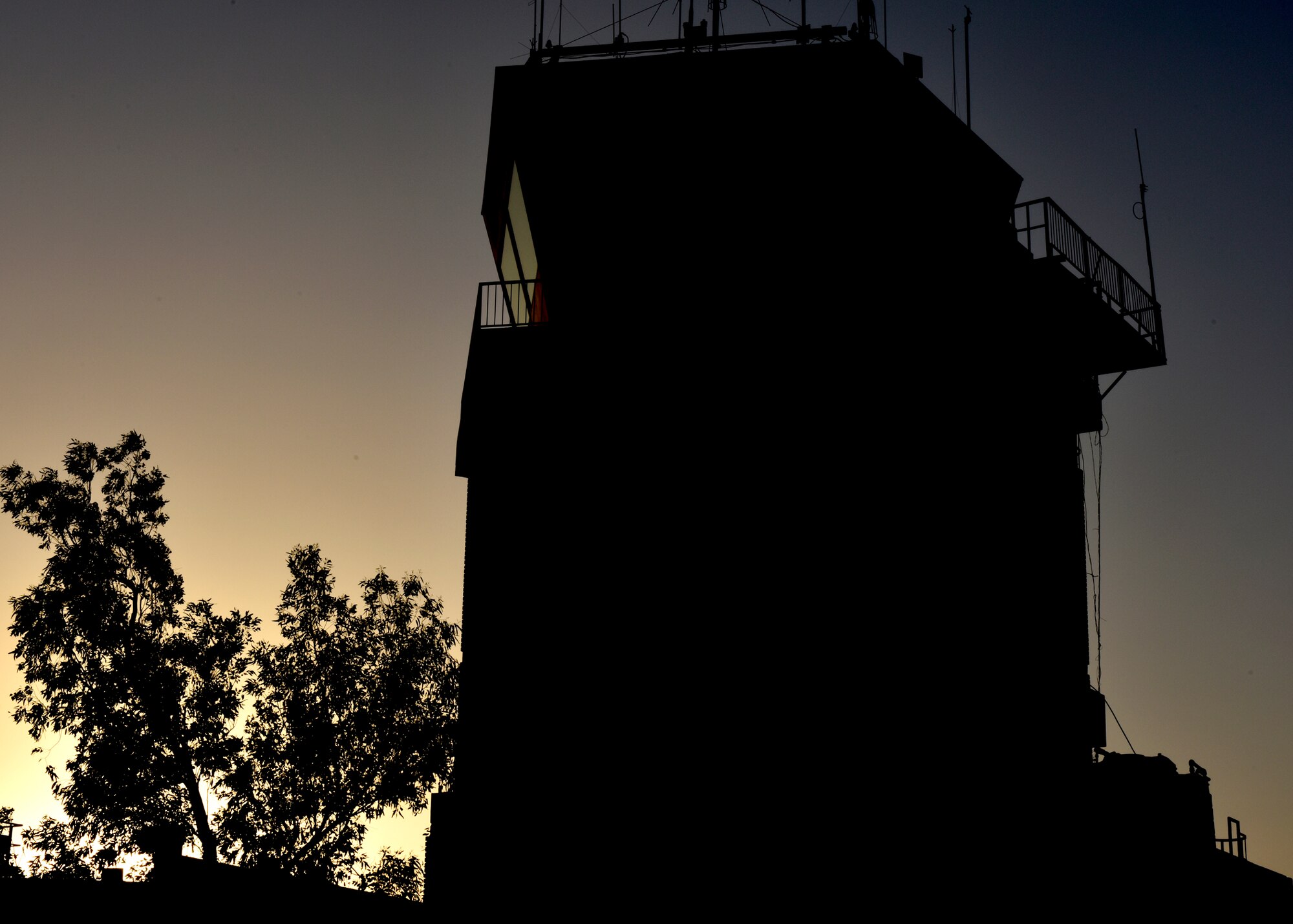 The 407th Air Expeditionary Group’s air traffic control tower as the sun sets May 14, 2017, in Southwest Asia. U.S. air traffic controllers take on a complex role while operating with coalition partners. The international partners have full control over the airfield, while the Air Force controllers focus on safety. (U.S. Air Force photo by Senior Airman Ramon A. Adelan) 