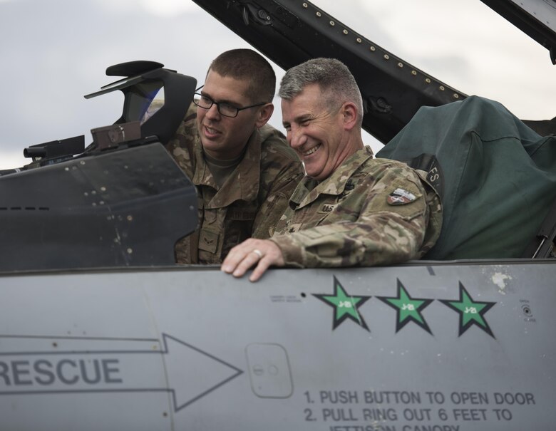 Airman 1st Class Andrew Meier, a 455th Expeditionary Aircraft Maintenance Squadron avionics apprentice, shows U.S. Army Gen. John Nicholson, commander of Resolute Support Mission and U.S. Forces Afghanistan, the cockpit of an F-16 Fighting Falcon at Bagram Airfield, Afghanistan, May 13, 2017. During his visit, Nicholson spoke with Airmen from the 555th Expeditionary Fighter Squadron about the F-16 and how it enables the train, advise, and assist mission in Afghanistan. (U.S. Air Force photo by Staff Sgt. Benjamin Gonsier)