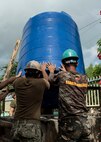A U.S. Navy Seabee and Philippine Soldier install a water storage tank during an engineering civic assistance project in support of Balikatan 2017 in Ormoc City, Leyte, May 12, 2017. Philippine and U.S. service members worked together to build new classrooms for students at Don Carlos Elementary School. Balikatan is an annual U.S.-Philippine bilateral military exercise focused on a variety of missions, including humanitarian assistance and disaster relief, counterterrorism, and other combined military operations. 