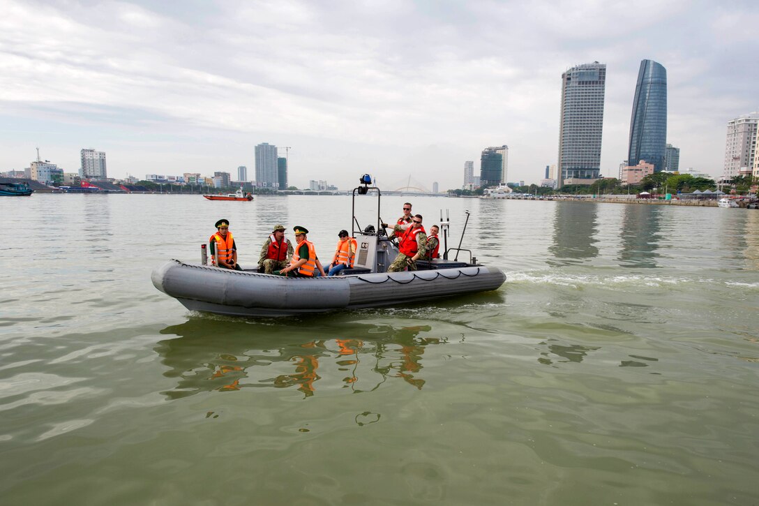 U.S. sailors and Vietnamese border patrol personnel are dispatched aboard a rigid hull inflatable boat while participating in a search, rescue and oil spill response field training exercise during Pacific Partnership 2017 in Da Nang, Vietnam, May 13, 2017. Navy photo by Petty Officer 2nd Class Chelsea Troy Milburn