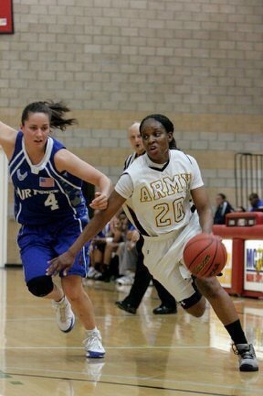 Army Capt. Octavia Blackwell dribbles past a defender during an Army-Air Force game, April 28, 2017. Army photo by Maj. Bryen C. Freigo