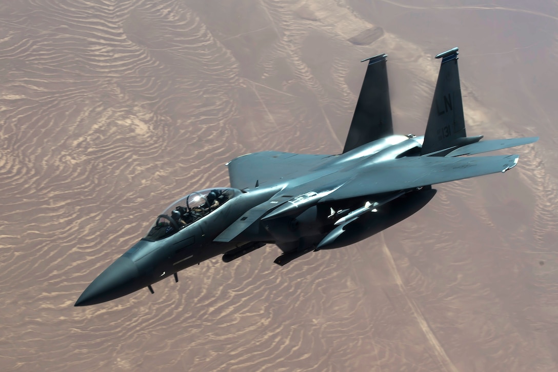 An Air Force F-15 Strike Eagle aircraft departs after being refueled by a KC-135 Stratotanker during a mission in support of Operation Inherent Resolve, May 9, 2017. Air Force photo by Staff Sgt. Michael Battles