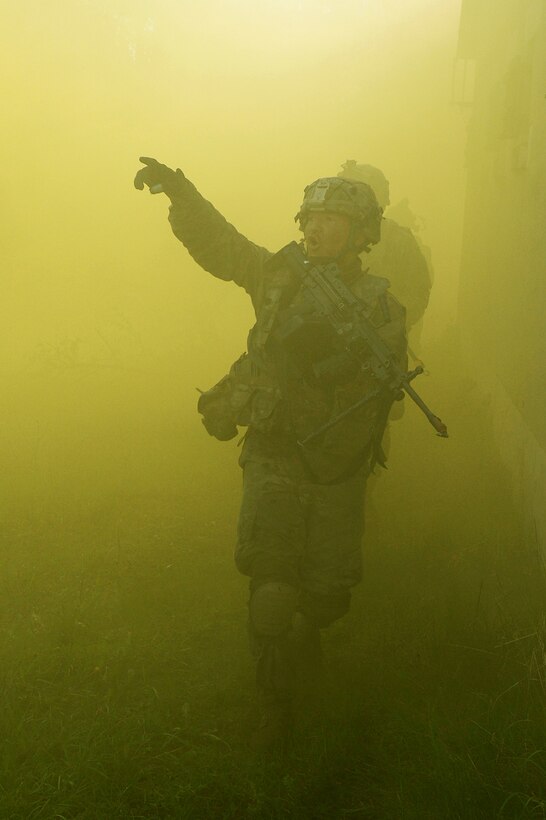 Soldiers call out their targets as they maneuver through the cover of smoke in the back alleys of a small mock village during a field training exercise as part of Saber Junction 17 at the Joint Multinational Readiness Center, Hohenfels, Germany, May 15, 2017. The soldiers are assigned to the 3rd Squadron, 2d Cavalry Regiment. Saber Junction 17 is the U.S. Army Europe’s 2nd Cavalry Regiment’s certification exercise, taking place at the Joint Multinational Readiness Center. Army photo by Staff Sgt. Richard Frost