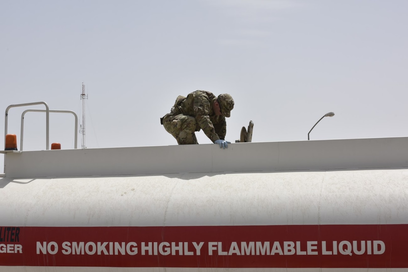Staff Sgt. Samuel Bonhorst, 407th Expeditionary Logistic Readiness Squadron petroleum, oil and lubricants flight fuels laboratory NCO in charge, drops a jar in a fuel truck to gather a sample before receiving a shipment May 10, 2017, in Southwest Asia. Fuel technicians maintain all POL substances, from diesel and gasoline to jet fuel and liquid oxygen. These materials play a vital role in delivering airpower to the fight against ISIS. The team here at the 407th Air Expeditionary Group supplies U.S. Marine Corps and coalition aircraft. (U.S. Air Force photo by Senior Airman Ramon A. Adelan)