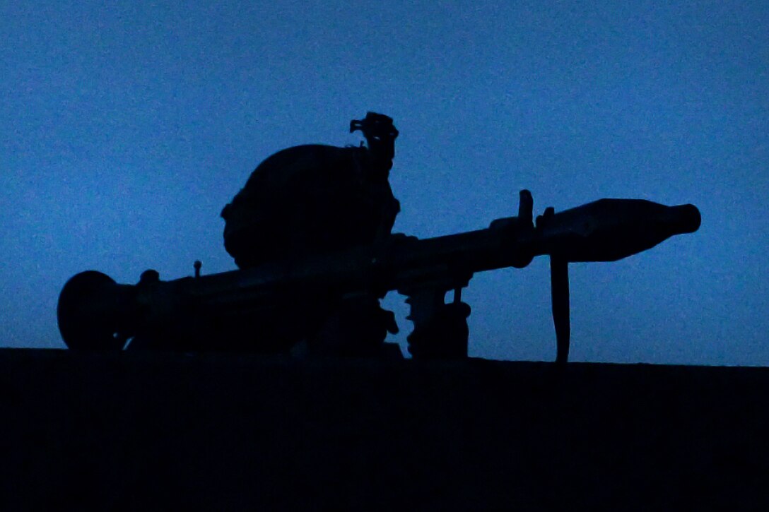 A soldier prepares to fire a rocket launcher from a rooftop during a field training exercise as part of Saber Junction 17 at the Joint Multinational Readiness Center, Hohenfels, Germany, May 15, 2017. Army photo by Staff Sgt. Richard Frost
