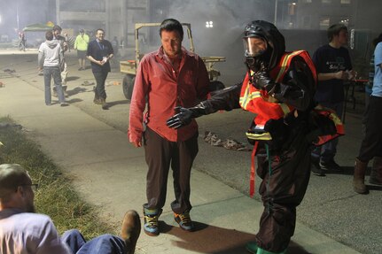 U.S. Army Reserve Soldiers from Madison, Wisconsin, based 409th Area Support Medical Company and 414th Chemical Company based in Orangeburg, South Carolina, work together to complete a mass casualty decontamination exercise May 8, 2017 at Muscatatuck Urban Training Center, Indiana. Nearly 4,100 Soldiers from across the country are participating in Guardian Response 17, a multi-component training exercise to validate U.S. Army units' ability to support the Defense Support of Civil Authorities (DSCA) in the event of a Chemical, Biological, Radiological, and Nuclear (CBRN) catastrophe. (U.S. Army Reserve photo by Sgt. Crystal Milton)