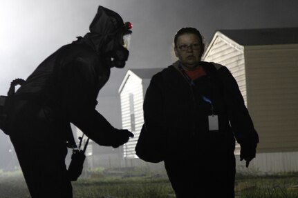 A U.S. Army Reserve Soldier from the 414th Chemical Company out of Orangeburg, South Carolina, directs a role-player casualty to the decontamination center at Muscatatuck Urban Training Center (MUTC) in Butlerville, Indiana, May 10, 2017. Nearly 4,100 Soldiers from across the country are participating in Guardian Response 17, a multi-component training exercise to validate U.S. Army units’ ability to support the Defense Support of Civil Authorities (DSCA) in the event of a Chemical, Biological, Radiological, and Nuclear (CBRN) catastrophe.