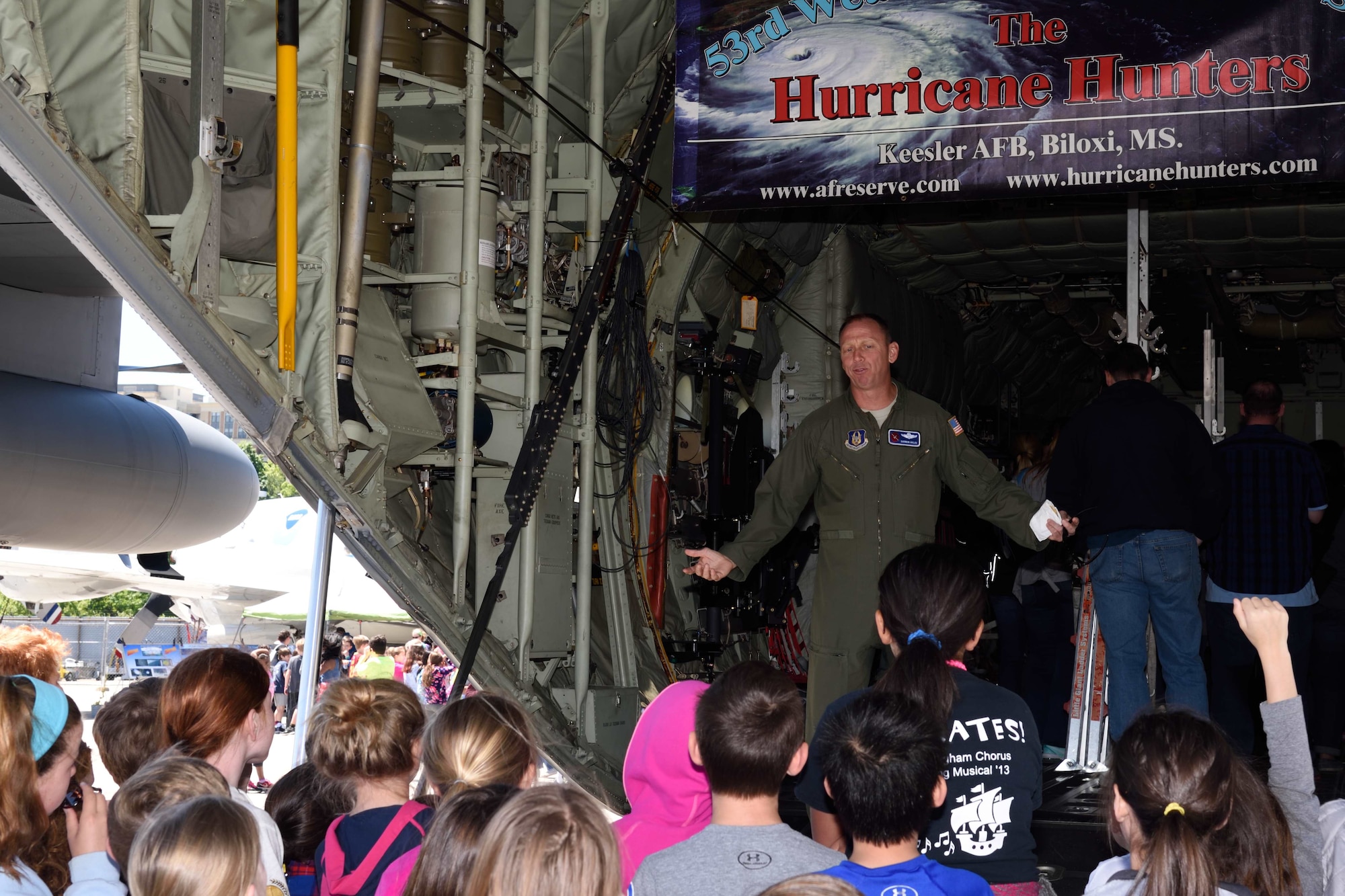 Lt. Col. Shannon Hailes, 53rd Weather Reconnaissance Squadron instructor pilot, talks to members of the public about the capabilities of the squadron’s WC-130J Hercules aircraft in Arlington, Virginia, during the 2017 Hurricane Awareness Tour May 9, 2017. The purpose of the tour, which ran from May 6-12, 2017, was to focus attention on the approaching hurricane season and on protecting communities through preparedness and awareness. (U.S. Air Force photo/Tech. Sgt. Ryan Labadens)
