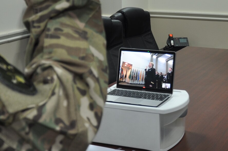 Maj. Bret Peters, the 737th Expeditionary Airlift Squadron assistant director of operations, administers the oath of office via teleconference to his daughter Army 2nd Lt. Brittany Peters during a commissioning ceremony at the University of North Carolina, Friday, May 12, 2017. Peters is a deployed member of the 386th Air Expeditionary Wing.