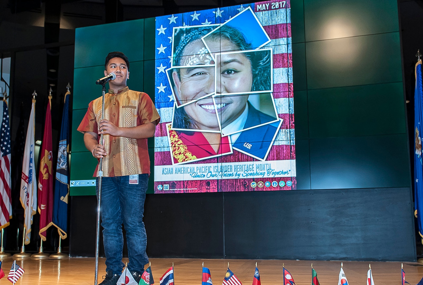 Tanaka Nhong, a founding member of the Khmer Student Association at The Ohio State University, sings the famous Cambodian song, “Louch Snae Doung Chan (The Moon that Stole My Heart).” Nhong's performance took place during the Asian American and Pacific Islander heritage month program at Defense Supply Center Columbus on May 10.
