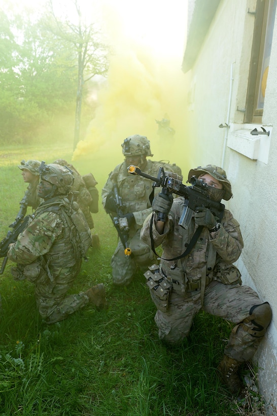 A soldier provides security while members of his team prepare to move to their next objective under the cover of smoke during a field training exercise as part of Saber Junction 17 at the Joint Multinational Readiness Center, Hohenfels, Germany, May 15, 2017. Army photo by Staff Sgt. Richard Frost
