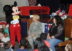 Mickey Mouse greets Brig. Gen. Heather Pringle, commander, 502nd Air Base Wing and Joint Base San Antonio at the Blue Star Families Books on Bases event at Joint Base San Antonio-Fort Sam Houston May 6.