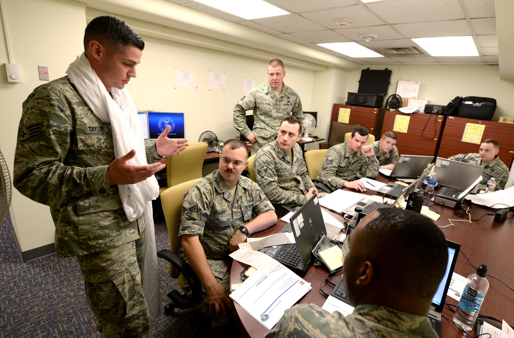 Staff Sgt. Brandon Taylor, 55th Contracting Squadron contract officer, provides guidance during a simulated payment discrepancy as part of a scenario used in a contracting contingency exercise May 10, 2017 at Offutt Air Force Base, Neb. The exercise lasted five days from May 8 – 12 and was designed to improve contracting readiness for bare base operations. (U.S. Air Force photo by Delanie Stafford)