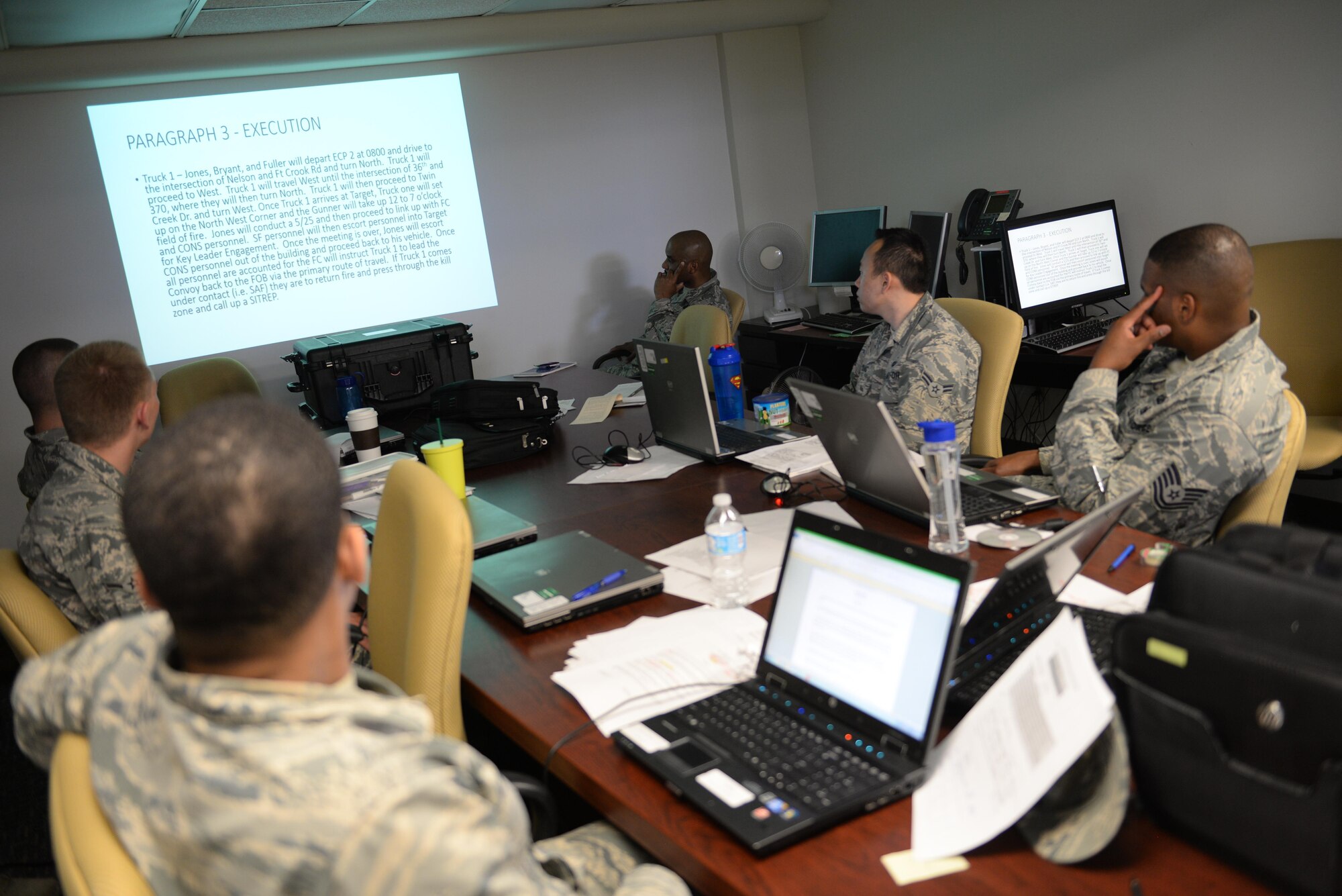 MSgt. James Arent, 55th Security Forces Squadron NCOIC of training, conducts convoy contingency training for Airmen assigned to the 55th Contracting Squadron at Offutt Air Force Base, Neb., May 10, 2017. Airmen participated in classroom instruction, with an in-depth discussion about what to expect in a deployed environment and how to properly handle different scenarios. (U.S. Air Force photo by Zachary Hada)