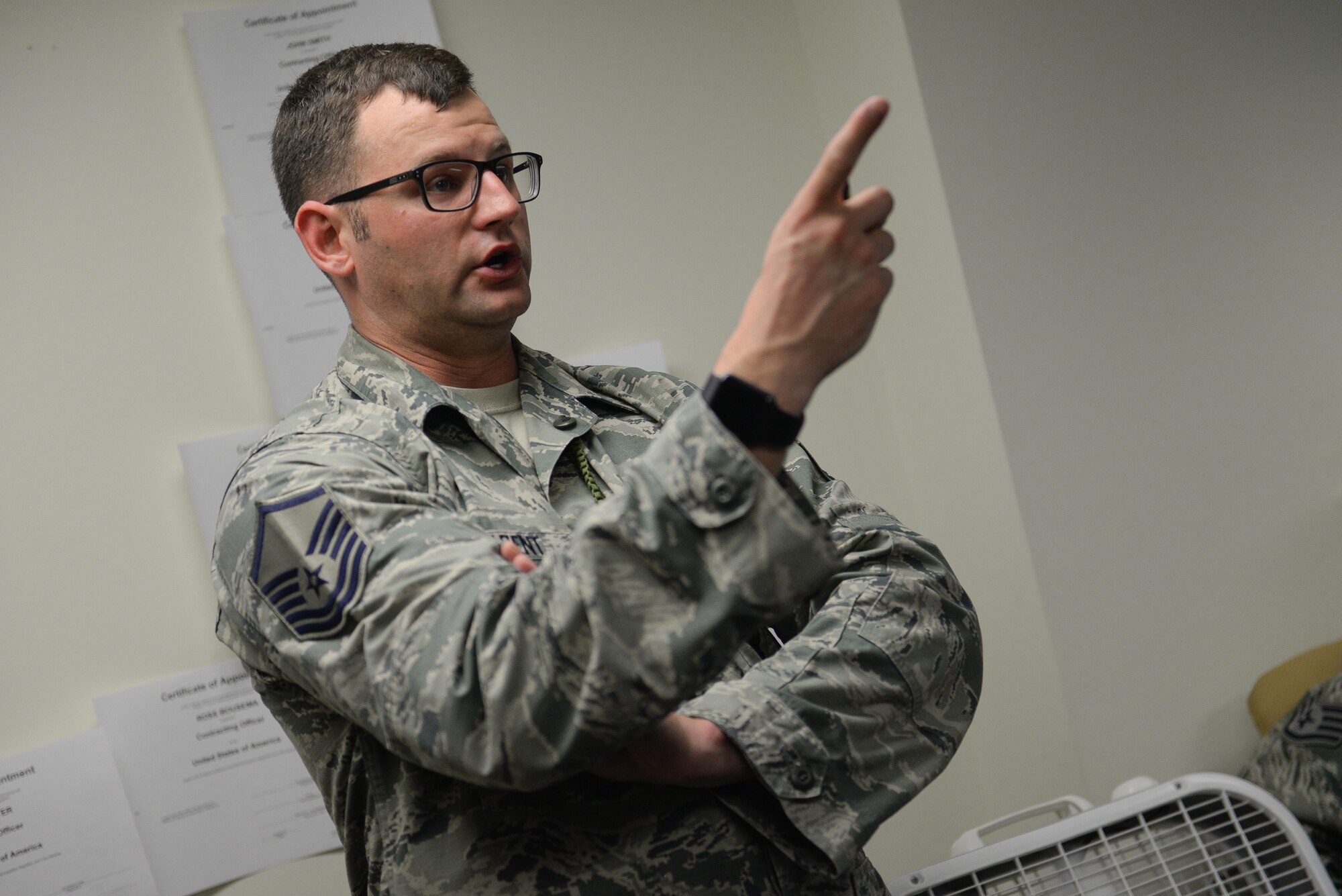 MSgt. James Arent, 55th Security Forces Squadron NCOIC of training, conducts convoy contingency training for Airmen assigned to the 55th Contracting Squadron at Offutt Air Force Base, Neb., May 10, 2017. Airmen participated in classroom instruction, with an in-depth discussion about what to expect in a deployed environment and how to properly handle different scenarios. (U.S. Air Force photo by Zachary Hada)