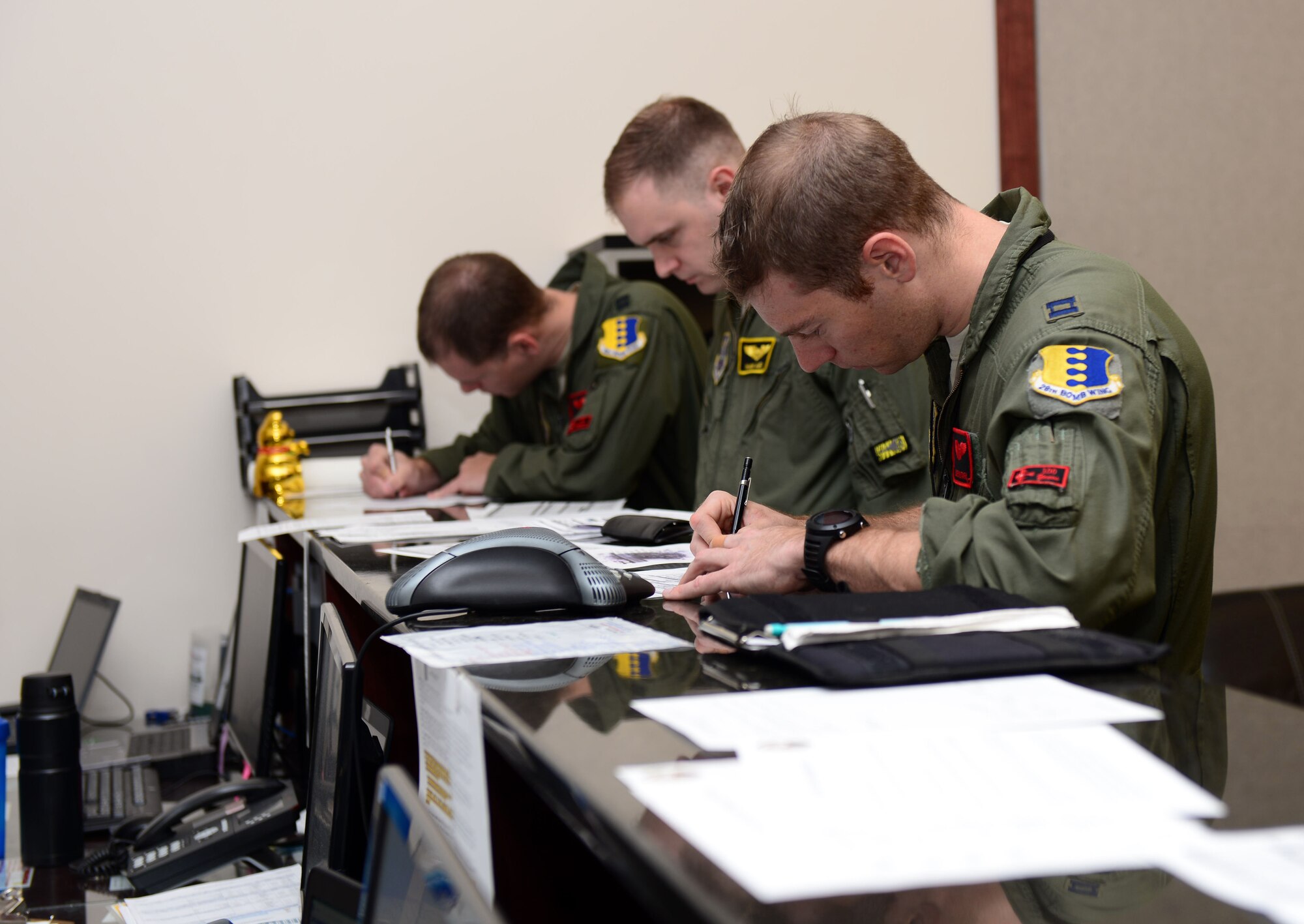 Pilots and weapon systems officers assigned to the 34th and 37th Bomb Squadrons, attend a step brief during the Combat Hammer exercise at Ellsworth Air Force Base, S.D., May 10, 2017. Combat Hammer is designed to assess and evaluate the reliability, maintainability, suitability and accuracy of precision-guided air-to-ground munitions. (U.S. Air Force photo by Airman 1st Class Donald C. Knechtel)