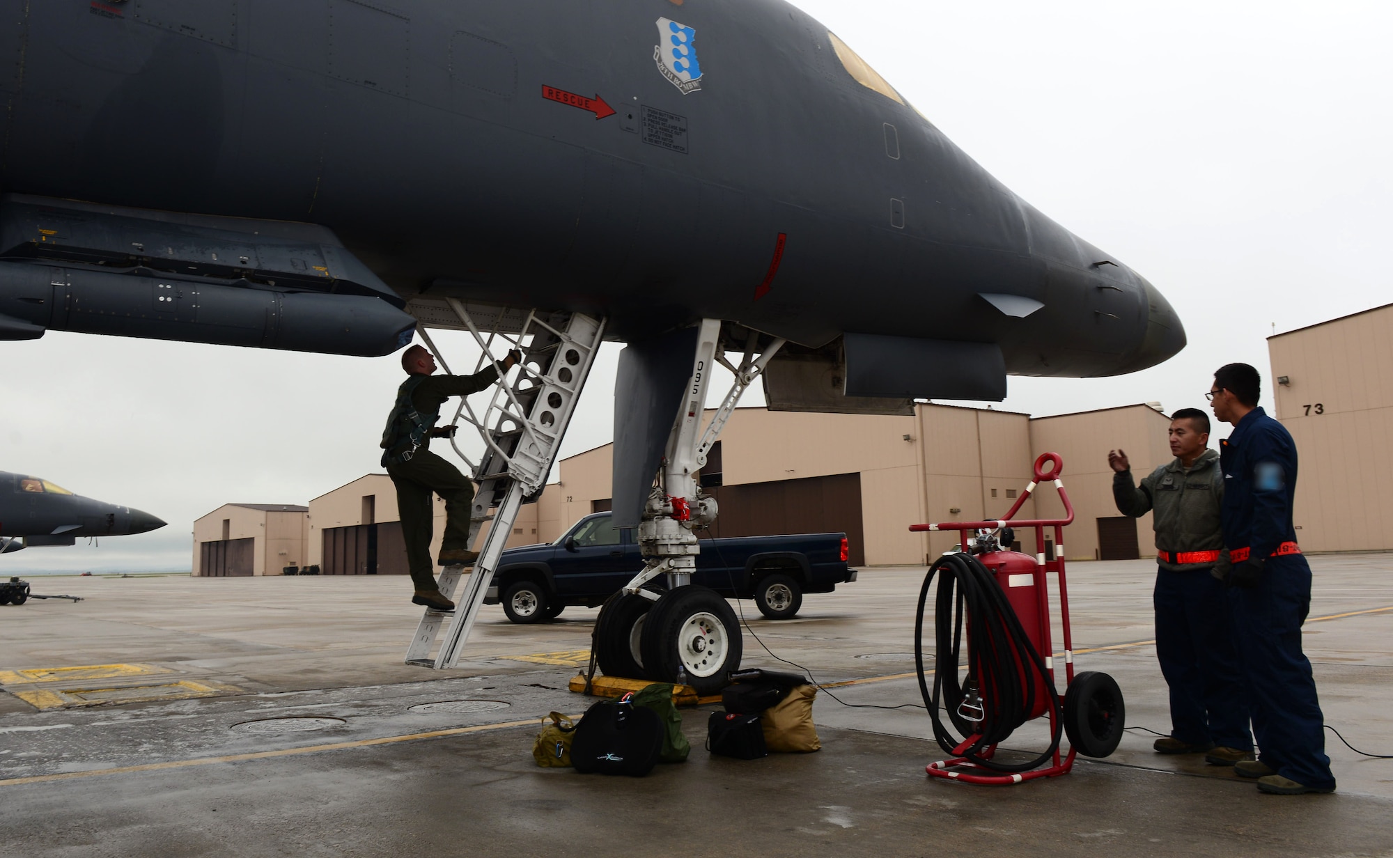 Capt. Dillen Stuhlsatz, a weapon systems officer assigned to the 34th Bomb Squadron, enters a B-1 bomber during the Combat Hammer exercise at Ellsworth Air Force Base, S.D., May 10, 2017. With a strong, credible B-1 force, Ellsworth aircrews and maintainers maintain a high state of readiness and proficiency, validating what Airmen bring to the fight – immediate global reach. (U.S. Air Force photo by Airman 1st Class Donald C. Knechtel)