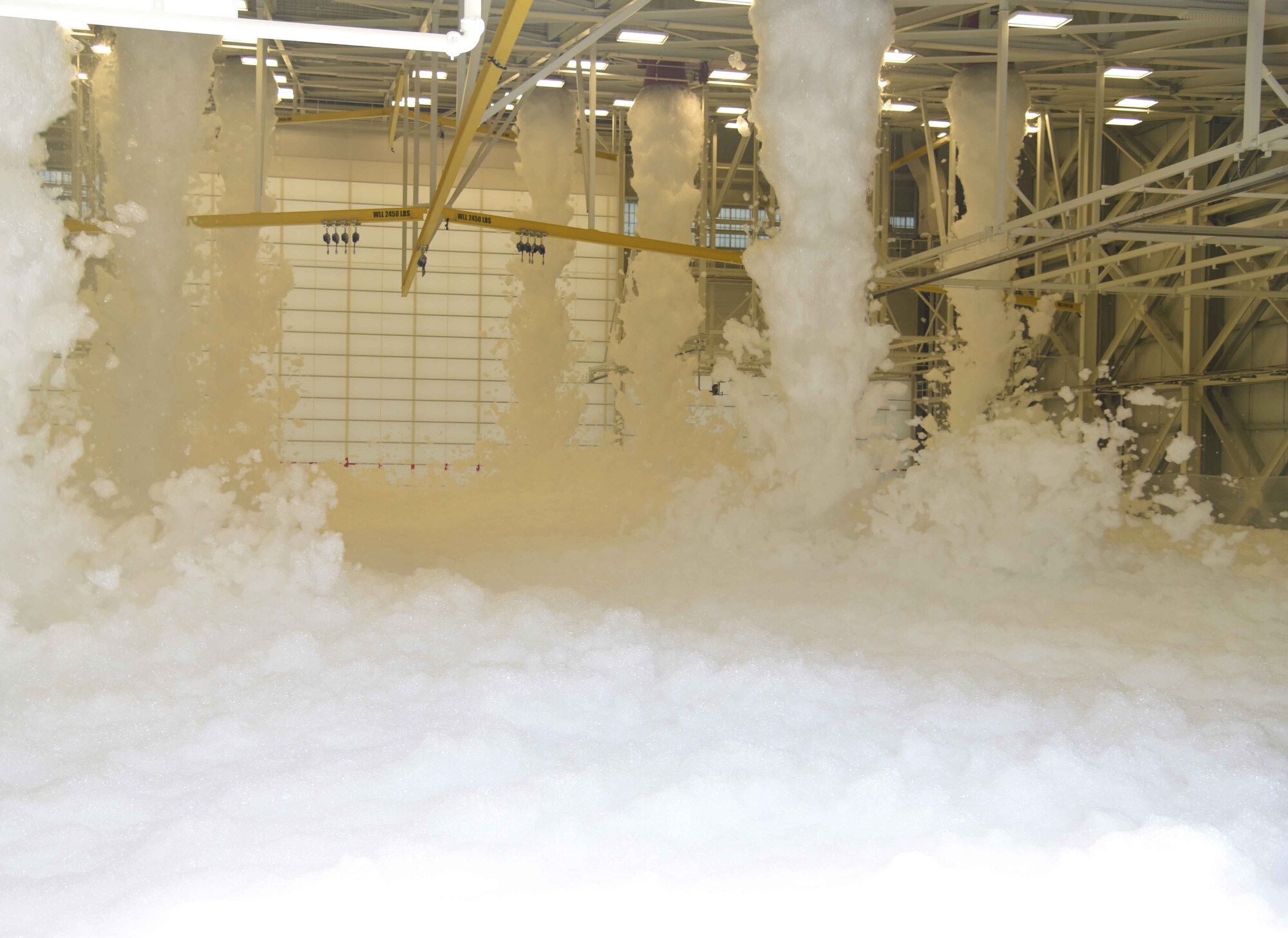 Foam from a fire suppression system fills a KC-46 Pegasus hangar during a test May 12, 2017 at McConnell Air Force Base, Kan. The three-bay hangar is the largest of the three hangars built on McConnell to house the KC-46. (U.S. Air Force photo/Airman 1st Class Erin McClellan)