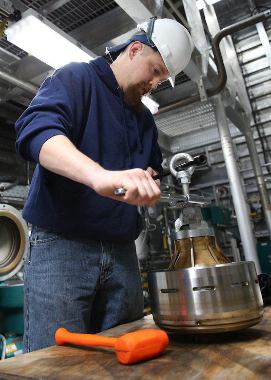 Justin Langan, the USNS Trenton’s third engineer, reassembles fuel filter components during an annual dry dock overhaul period in Marseilles, France, April 7, 2017. Trenton is one of only eight expeditionary fast transport ships in the Military Sealift Command’s inventory. Military Sealift Command- Europe photo by Matthew Montgomery