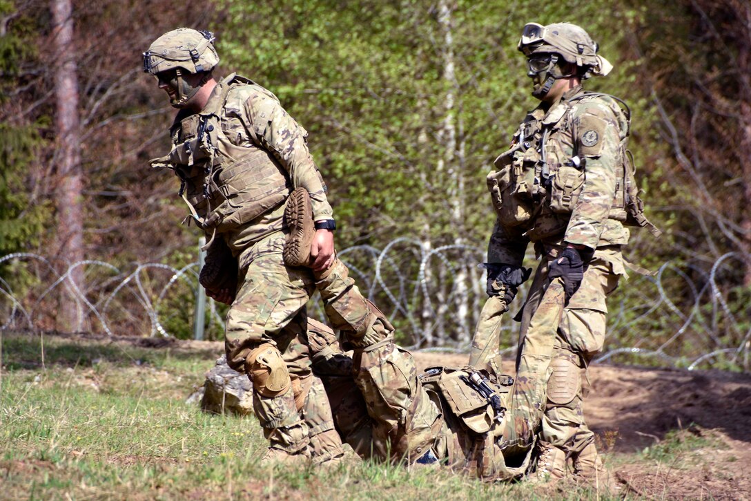 Soldiers carry a mock casualty to a medical vehicle during Saber Junction 17 at the Hohenfels Training Area, Germany, May 6, 2017. Army photo by Sgt. Devon Bistarkey