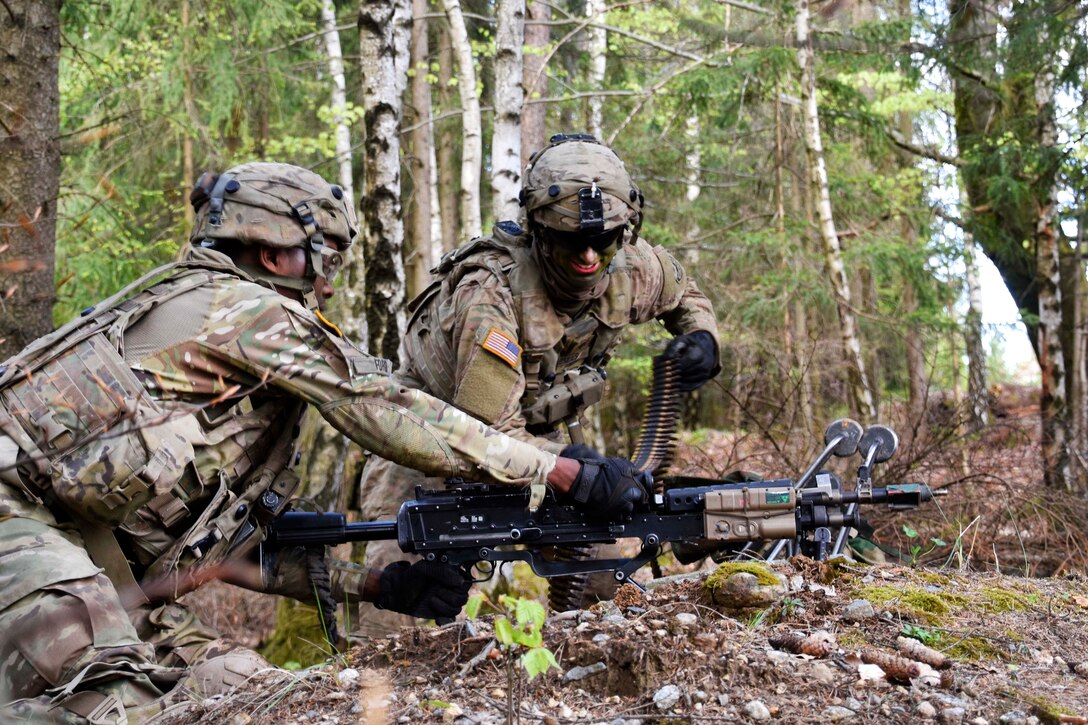 Soldiers load ammo into a machine gun while conducting land operations during Saber Junction 17 at the Hohenfels Training Area, Germany, May 6, 2017. Army photo by Sgt. Devon Bistarkey
