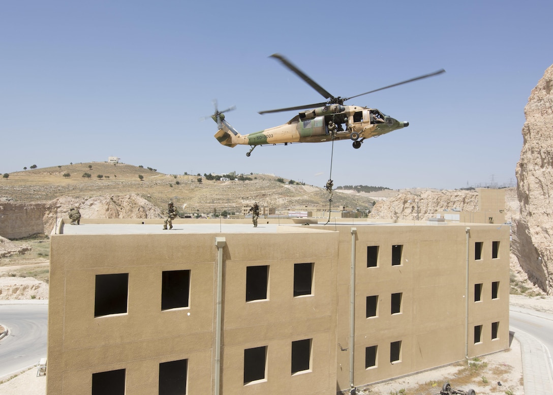 AMMAN, Jordan (May 11, 2017) Members of the Air Force Special Operations from the 23rd Special Tactics Squadron fast rope from a Jordanian UH-60 helicopter during an exercise in support of Eager Lion 2017. Eager Lion is an annual U.S. Central Command exercise in Jordan designed to strengthen military-to-military relationships between the U.S., Jordan and other international partners. This year's iteration is comprised of about 7,200 military personnel from more than 20 nations that will respond to scenarios involving border security, command and control, cyber defense and battlespace management. (U.S. Navy photo by Mass Communication Specialist 2nd Class Christopher Lange/Released)