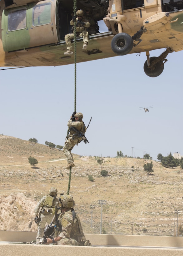 AMMAN, Jordan (May 11, 2017) Members of the Air Force Special Operations from the 23rd Special Tactics Squadron fast rope from a Jordanian UH-60 helicopter during an exercise in support of Eager Lion 2017.  Eager Lion is an annual U.S. Central Command exercise in Jordan designed to strengthen military-to-military relationships between the U.S., Jordan and other international partners. This year's iteration is comprised of about 7,200 military personnel from more than 20 nations that will respond to scenarios involving border security, command and control, cyber defense and battlespace management. (U.S. Navy photo by Mass Communication Specialist 2nd Class Christopher Lange/Released)