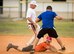 Cody Gunton, 96th Communications Squadron team, checks to see if he is safe at second base before getting up during his team’s intramural softball game against the 33rd Maintenance Group team at Eglin Air Force Base, Fla., May 11.  The CS team won easily over the MXG team during the opening week of the intramural softball season.  (U.S. Air Force photo/Samuel King Jr.)