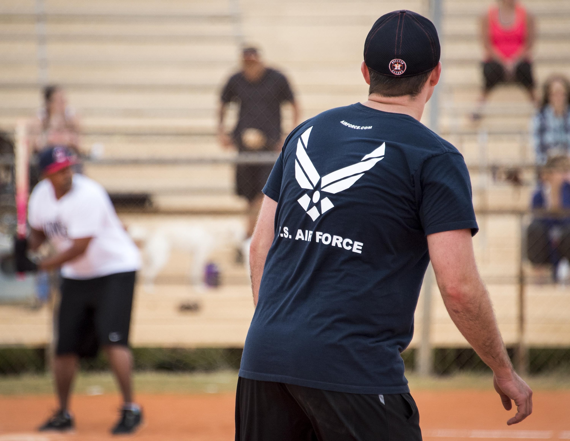 A 33rd Maintenance Group team member stands ready to run on first base during their team’s intramural softball game against the 96th Communications Squadron team at Eglin Air Force Base, Fla., May 11.  The CS team won easily over the MXG team during the opening week of the intramural softball season.  (U.S. Air Force photo/Samuel King Jr.)