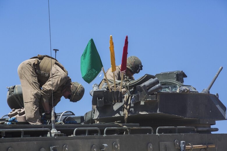 Marines with 3rd Assault Amphibious Battalion prepare for a live fire exercise at Range 106 A aboard Marine Corps Air Ground Combat Center, Twentynine Palms, Calif., May 4, 2017. Marine Corps Operational Test and Evaluation Activity Office conducted the exercise as part of operational testing used to compare an upgraded AAV to its old variant. (U.S. Marine Corps photo by Cpl. Thomas Mudd)