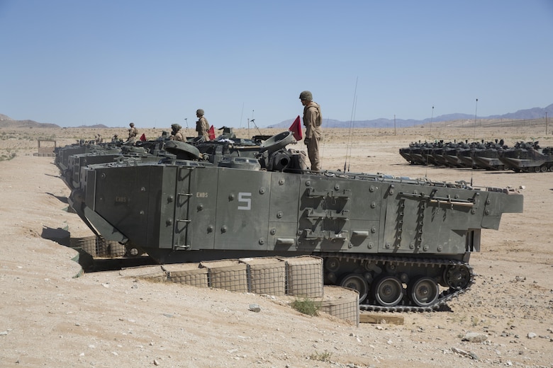 Marines with 3rd Assault Amphibious Battalion prepare for a live fire exercise at Range 106 A aboard Marine Corps Air Ground Combat Center, Twentynine Palms, Calif., May 4, 2017. Marine Corps Operational Test and Evaluation Activity Office conducted the exercise as part of operational testing used to compare an upgraded AAV to its old variant. (U.S. Marine Corps photo by Cpl. Thomas Mudd)