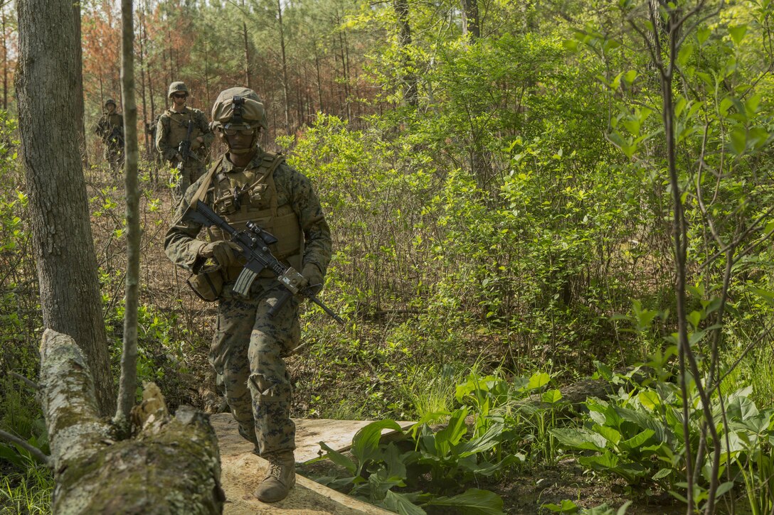 A Marine patrols a path during a company attack exercise at Fort A.P. Hill, Va., May 1, 2017. The Marines conducted a live-fire exercise that helped improve their leadership and teamwork abilities. The Marines are with G Company, 2nd Battalion, 2nd Marine Regiment. (U.S. Marine Corps photo by Pfc. Abrey D. Liggins)