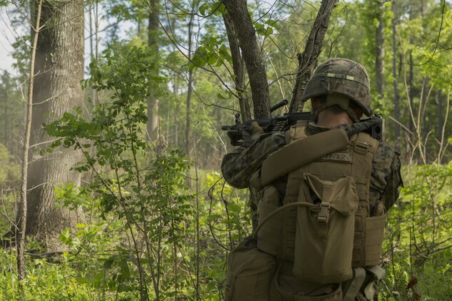 A Marine fires an M249 light machine gun at a target during a company attack exercise at Fort A.P. Hill, Va., May 1, 2017. The Marines conducted a live-fire exercise that helped improve their leadership and teamwork abilities. The Marines are with G Company, 2nd Battalion, 2nd Marine Regiment. (U.S. Marine Corps photo by Pfc. Abrey D. Liggins)