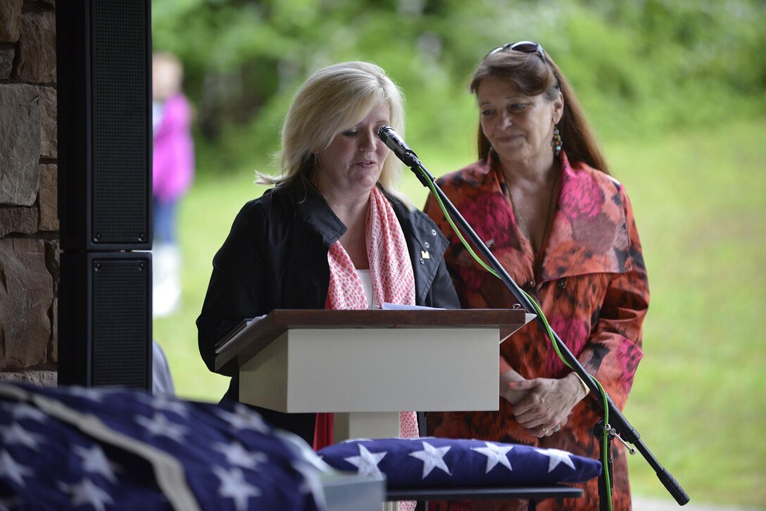 Stephanie Fister (Left) and Sharon Osborne, descendants of Revolutionary War Private Samuel Howard, represent the family during Howard's reinterment May 12, 2017 at Resthaven Cemetery in Baxter, Ky. The U.S. Army Corps of Engineers Nashville District worked with local community and state officials to move Howard from Wix-Howard Cemetery when his grave was endangered by soil movement from a design deficiency of a flood control project completed in the 1990s.