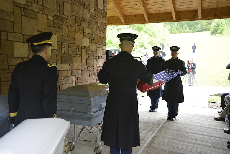 Soldiers from the 3rd United States Infantry Regiment, the Old Guard, fold a flag during a reinterment May 12, 2017 for Private Samuel Howard, Revolutionary War soldier, at Resthaven Cemetery in Baxter, Ky. 