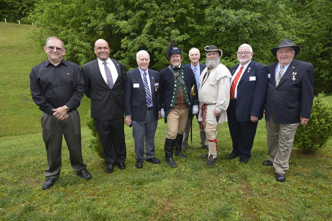 A group representing the Sons of Revolution from various states and descendants of Revolutionary War Private Samuel Howard, pose for a photo before the ceremony during Howard's reinterment May 12, 2017 at Resthaven Cemetery in Baxter, Ky. The U.S. Army Corps of Engineers Nashville District worked with local community and state officials to move Howard from Wix-Howard Cemetery when his grave was endangered by soil movement from a design deficiency of a flood control project completed in the 1990s. (USACE photo by Mark Rankin)