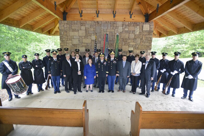 U.S. Army Corps of Engineer Nashville District employees pose with soldiers from the 3rd United States Infantry Regiment, traditionally known as "The Old Guard,"during Howard's reinterment May 12, 2017 at Resthaven Cemetery in Baxter, Ky. The U.S. Army Corps of Engineers Nashville District worked with local community and state officials to move Howard from Wix-Howard Cemetery when his grave was endangered by soil movement from a design deficiency of a flood control project completed in the 1990s.