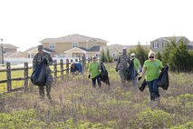 Volunteers from Pratt & Whitney, 72nd Civil Engineering-Housing, 552nd Air Control Wing and even a couple of military spouses and their children helped Natural Resources personnel in a trash cleanup of the Urban Greenway area around base housing and the Scissortail Trail area April 28. Two cubic yards of trash and debris were removed from the area, which was a vast improvement from 2014, the first year Natural Resources held a voluntary cleanup of the area, when they collected 33 cubic yards. (Air Force photo by Kelly White)