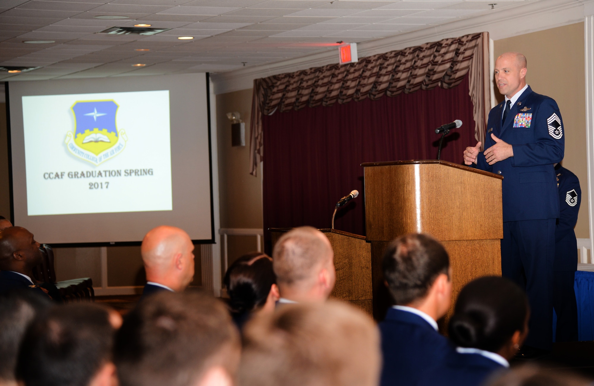 Chief Master Sgt. Randy L. Kay II, superintendent of the 552nd Operations Group, was the guest speaker at the Community College of the Air Force Graduation May 4. 133 graduates received 141 degrees during the ceremony. (Air Force photo by Kelly White)