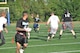 72nd Security Forces QB Eric Huston takes aim at Letrelle Hunter as Five-O moved on to a 25-0 defeat May 2 of Reserve White at the intramural field north of the dorms. (Air Force photo by John Parker)