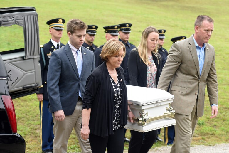 Descendents of Revolutionary War Private Samuel Howard carry the remains of his daughter (unnamed but referred to as Baby Howard) during a reinternment ceremony May 12, 2017 at Resthaven Cemetery in Baxter, Ky.  The U.S. Army Corps of Engineers Nashville District worked with local community and state officials to move Howard, his wife Chloe, and Baby Howard from Wix-Howard Cemetery when the graves were endangered by soil movement from a design deficiency of a flood control project completed in the 1990s. 