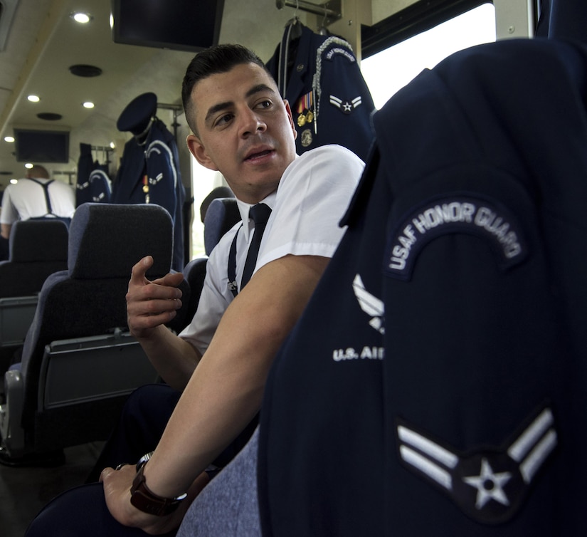 Airman 1st Class Jose Velazquez, U.S. Air Force Honor Guard firing party member, sits on a bus at Arlington National Cemetery in Arlington, Va., April 13, 2017. Velazquez gained citizenship after completing Air Force basic training and is now a member of the Honor Guard. (U.S. Air Force photo by Senior Airman Philip Bryant)