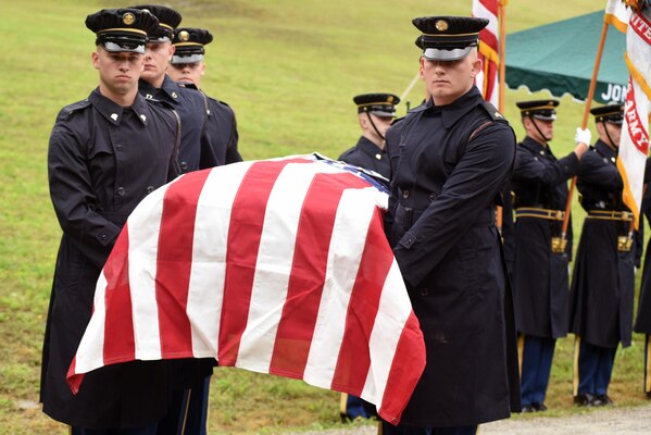 Soldiers from the 3rd United States Infantry Regiment, traditionally known as "The Old Guard," carry American Revolutionary War Private Samuel Howard during a reinterment ceremony at Resthaven Cemetery in Baxter, Ky. The U.S. Army Corps of Engineers Nashville District worked with local community and state officials to move Howard from Wix-Howard Cemetery when his grave was endangered by soil movement from a design deficiency of a flood control project completed in the 1990s. 