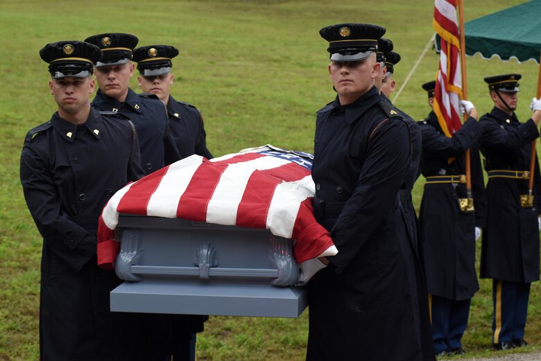 Soldiers from the 3rd United States Infantry Regiment, traditionally known as "The Old Guard," carry American Revolutionary War Private Samuel Howard during a reinterment ceremony at Resthaven Cemetery in Baxter, Ky. The U.S. Army Corps of Engineers Nashville District worked with local community and state officials to move Howard from Wix-Howard Cemetery when his grave was endangered by soil movement from a design deficiency of a flood control project completed in the 1990s.