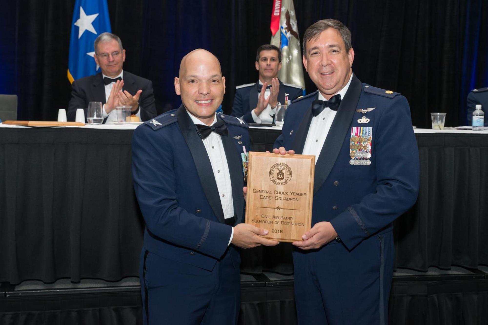Civil Air Patrol Major Keith Barry, right, the squadron commander with the Civil Air Patrol General Chuck Yeager Cadet Squadron, receives the 2017 CAP Squadron of Distinction award for the southeast region during the Florida Wing Conference in Orlando, Fla., April 29, 2017. The southeast region consists of the wings in Florida, Alabama, Georgia, Mississippi, Tennessee, Puerto Rico and the U.S. Virgin Islands. (courtesy photo)
