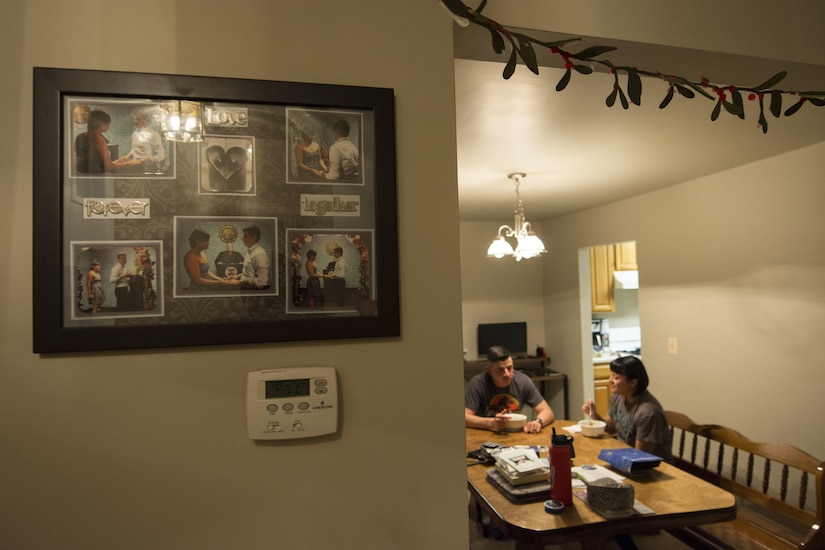 Airman 1st Class Jose Velazquez, U.S. Air Force Honor Guard firing party member, and Samantha Velazquez, Jose’s spouse, eat dinner in their home at Joint Base Anacostia-Bolling, District of Colombia, April 14, 2017. Samantha was born an American citizen and when the two got married five years ago, Jose became a resident of the country which allowed him to join the Air Force. (U.S. Air Force photo by Senior Airman Philip Bryant)