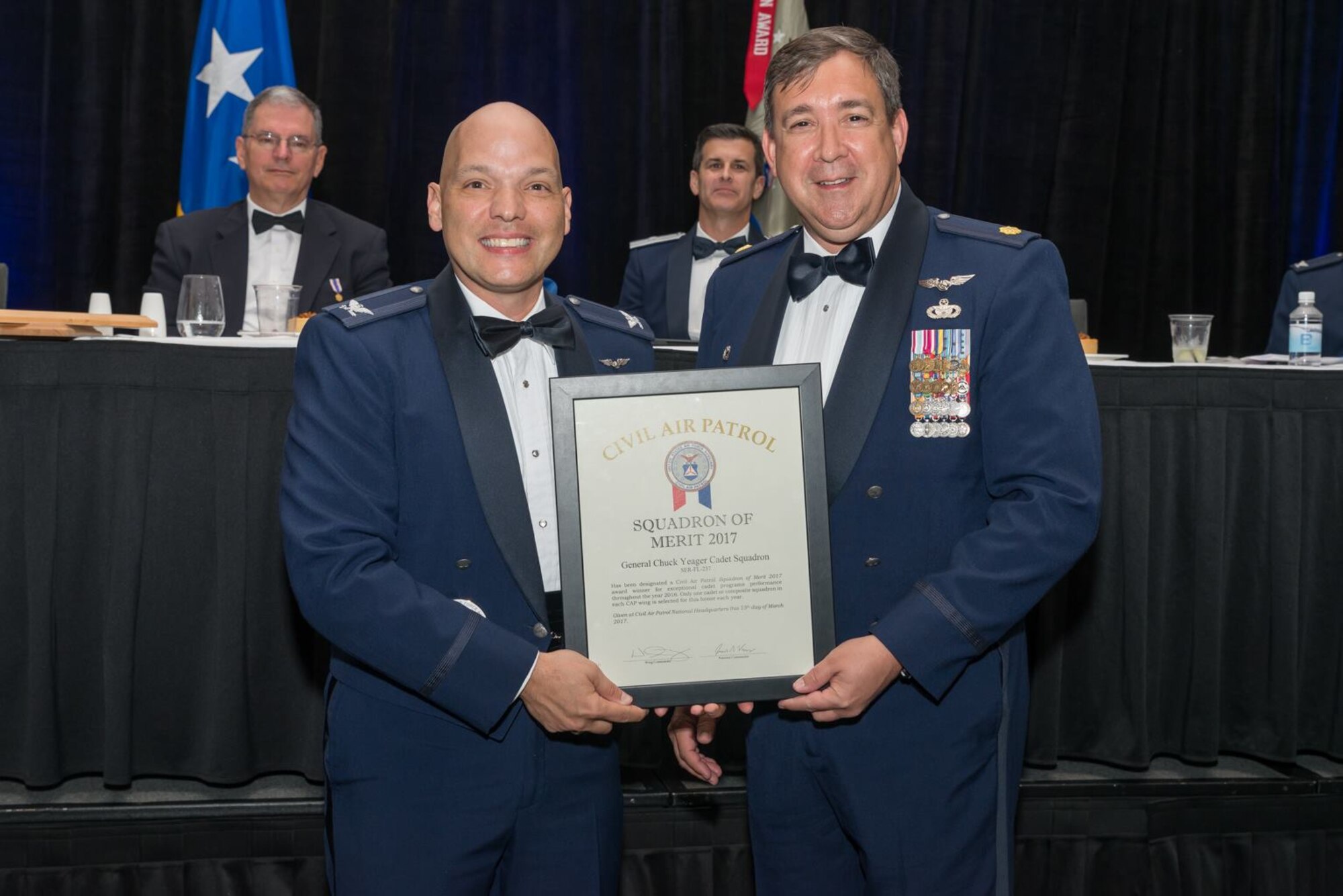 Civil Air Patrol Major Keith Barry, right, the squadron commander with the Civil Air Patrol General Chuck Yeager Cadet Squadron, receives the Florida CAP Wing 2017 Squadron of Merit award during the Florida Wing Conference in Orlando, Fla., April 29, 2017. Their squadron was hand selected out of nearly 80 squadrons. (courtesy photo)