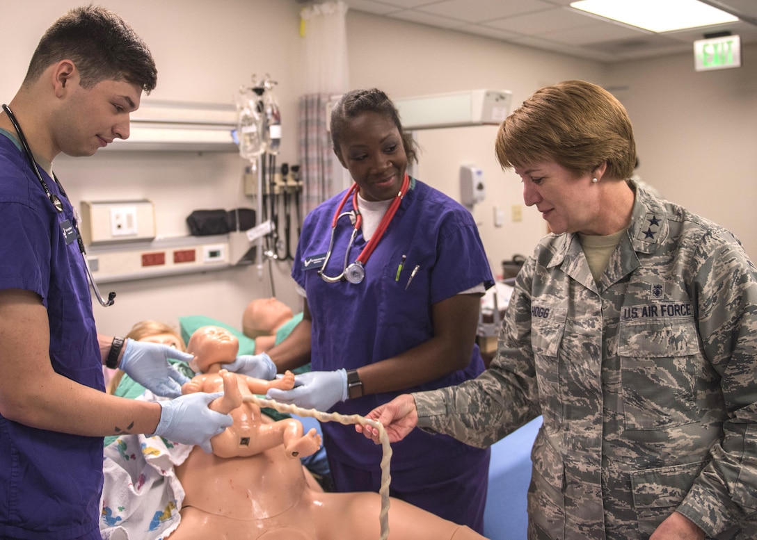 96th Medical Group Airmen speak to Deputy Surgeon General and Chief of the Air Force Nurse Corps, Maj. Gen. Dorothy A. Hogg about the simulation mannequin during her visit to Eglin Air Force Base, Fla. May 12.  The Airmen responded to a simulated baby delivery by Victoria, the training mannequin. Hogg’s visit took place during National Nurses and Technician Week. (U.S. Air Force photo/Ilka Cole)