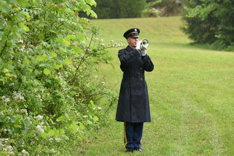 The bugler from the Old Guard, 3rd United States Infantry Regiment from Fort Myers, Va., plays taps May 12, 2017 during the reinterment of Private Samuel Howard, Revolutionary War soldier, at Resthaven Cemetery in Baxter, Ky.